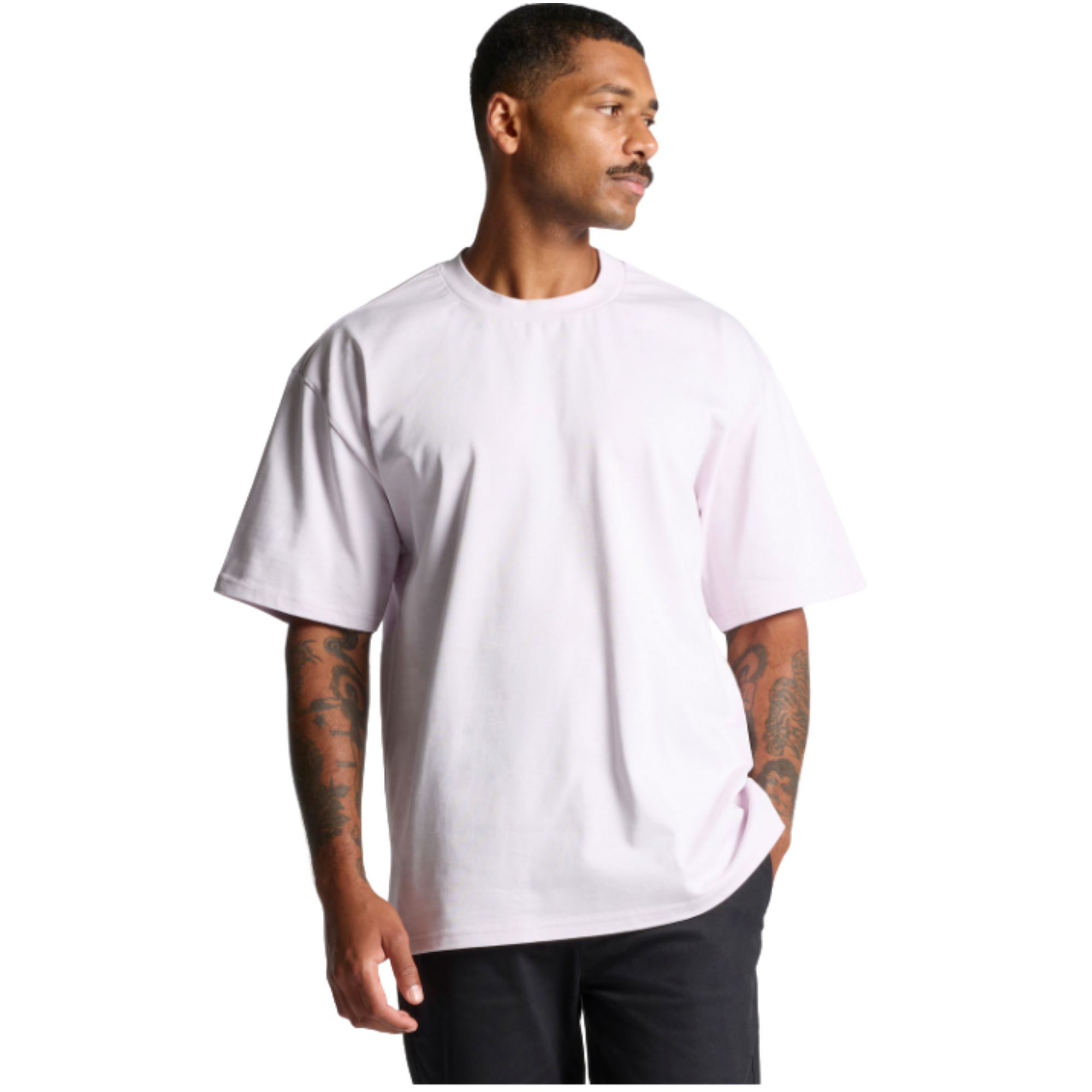 Man wearing oversized white graphic tee, streetwear style with tattoos, casual everyday look