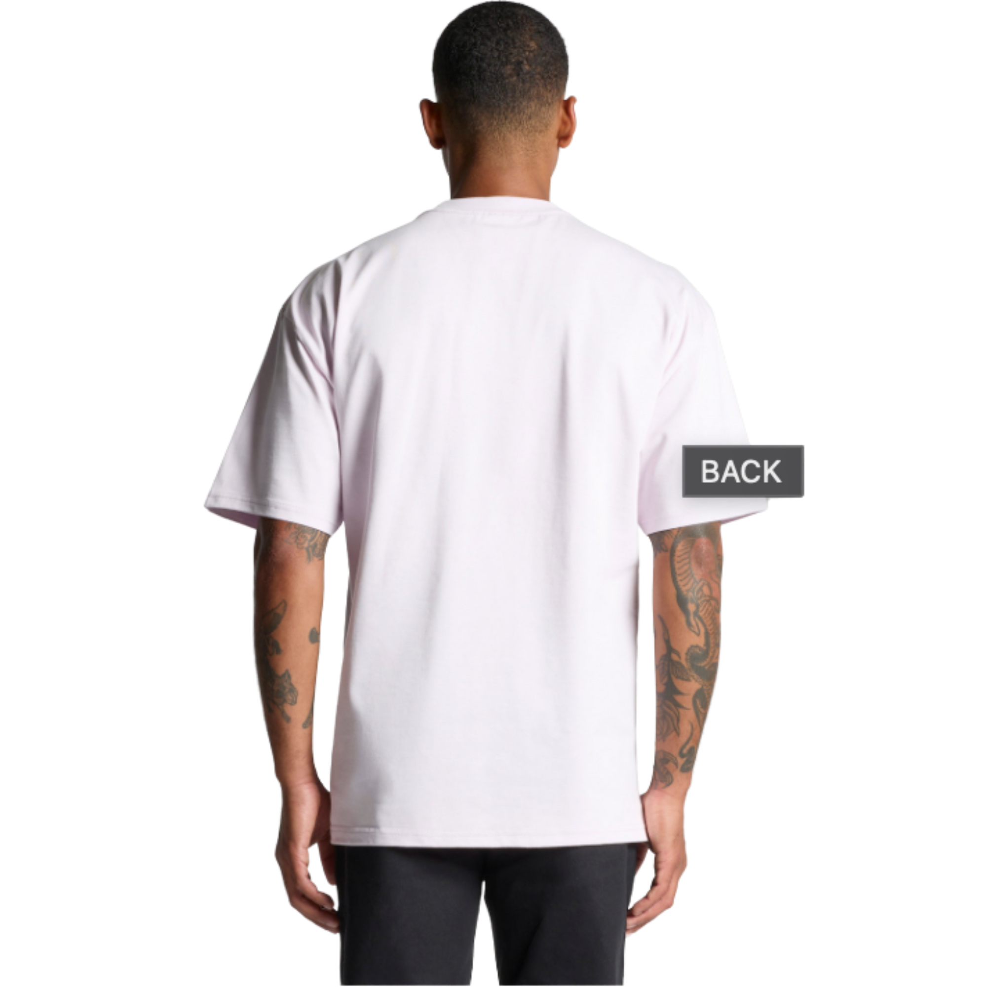 Back view of man wearing plain white graphic t-shirt, showcasing streetwear style with tattooed arms