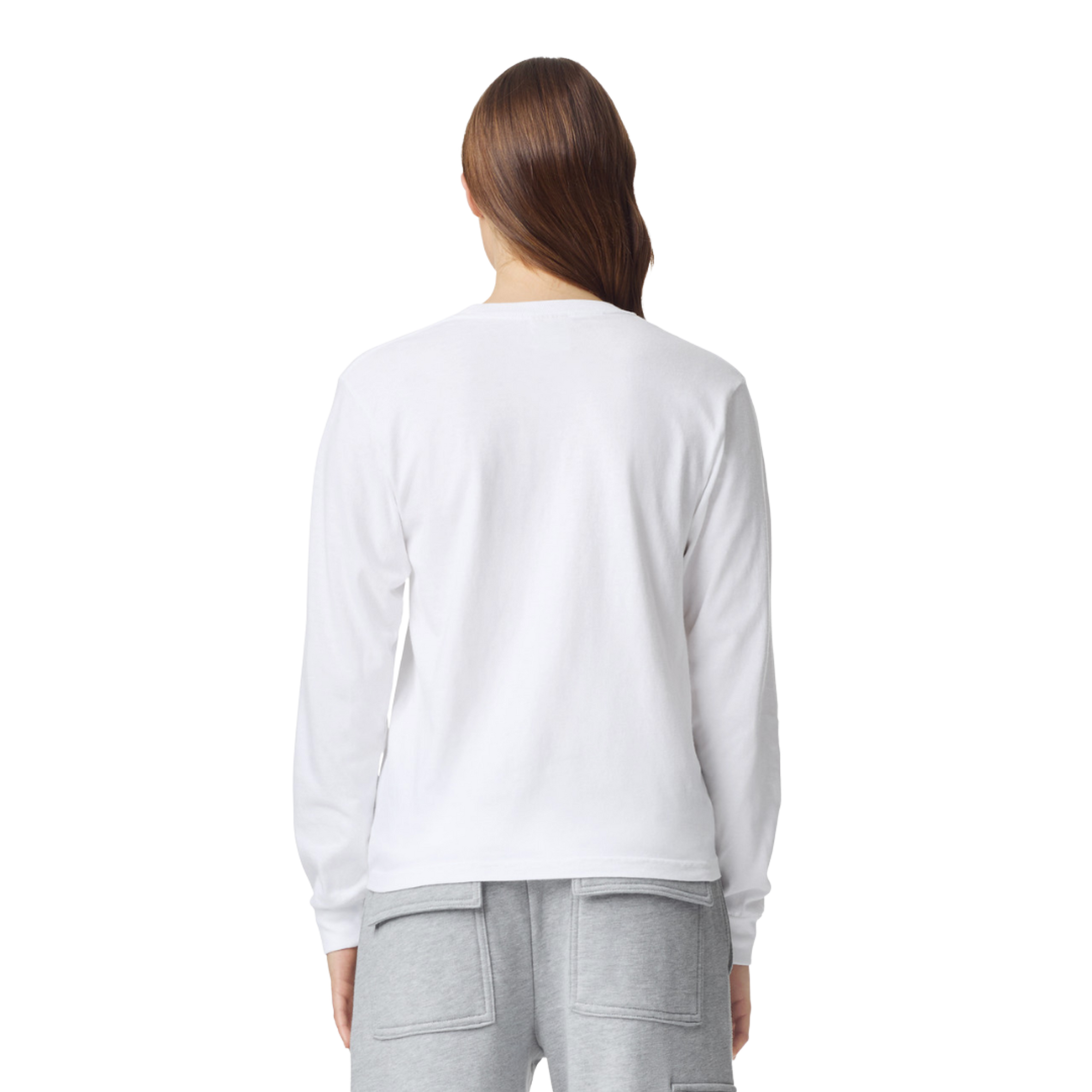 Woman wearing white long sleeve graphic tee with gray sweatpants, back view