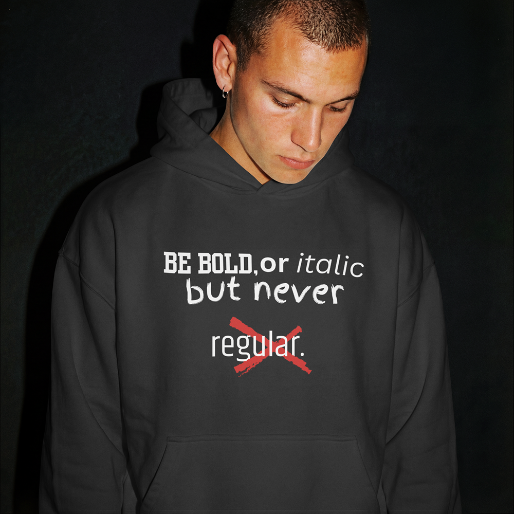 Bold graphic hoodie with 'BE BOLD, or italic but never regular' text, streetwear style apparel